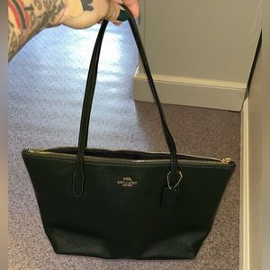 Coach shoulder bag small tote. Used 3 times, hunter green with navy blue inside